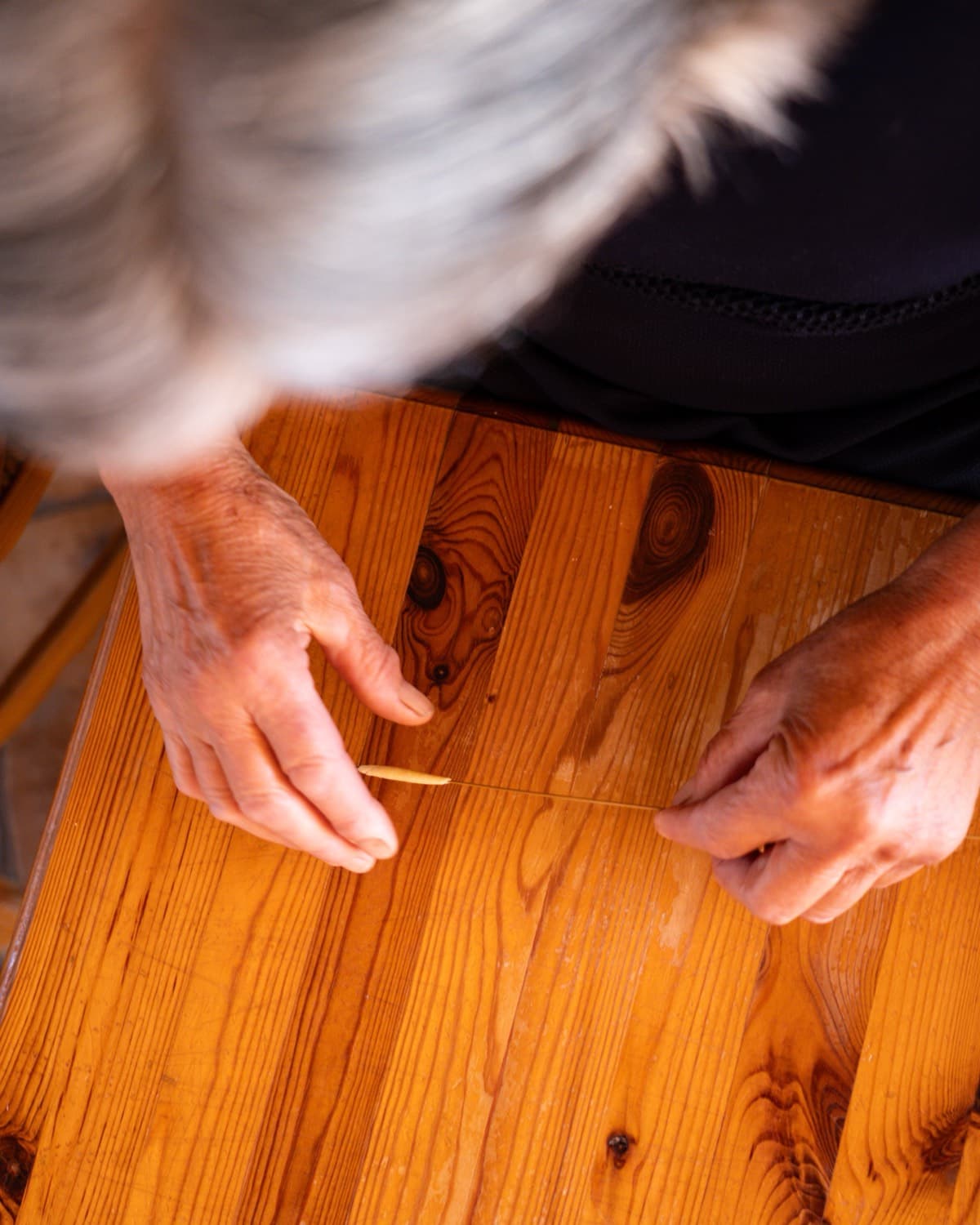 Hands making pasta by hand